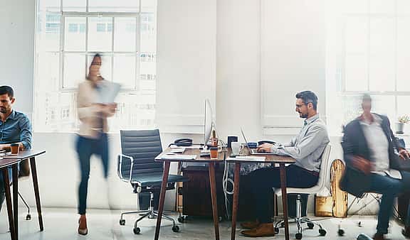 busy, bright, office space researching leasing and financial solutions for service industry with grenke
